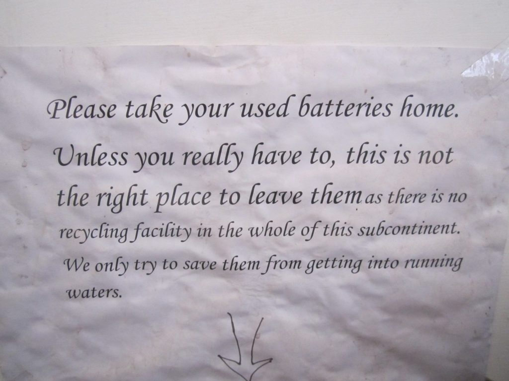 The "take your batteries home" request sign