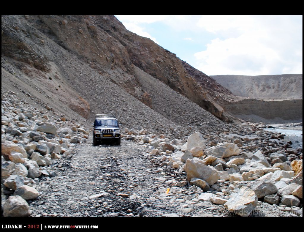 Open Ladakh road connecting Nubra Valley toward Pangong Tso under a clear October sky