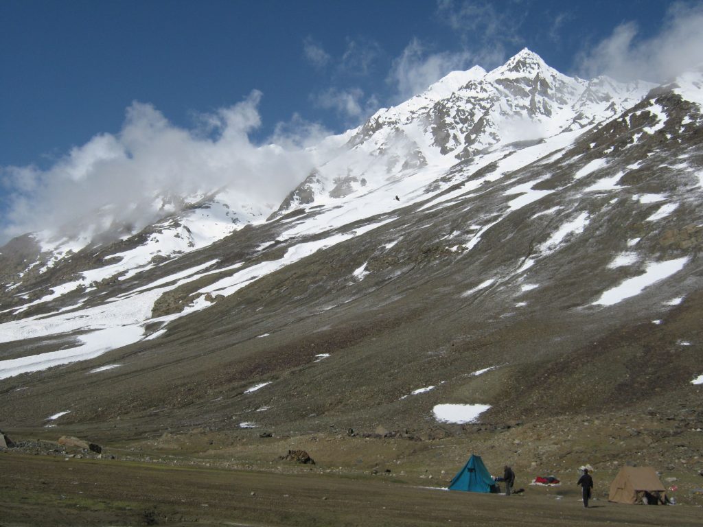 Tents pitched near Chandratal in Spiti Valley with snow-capped peaks