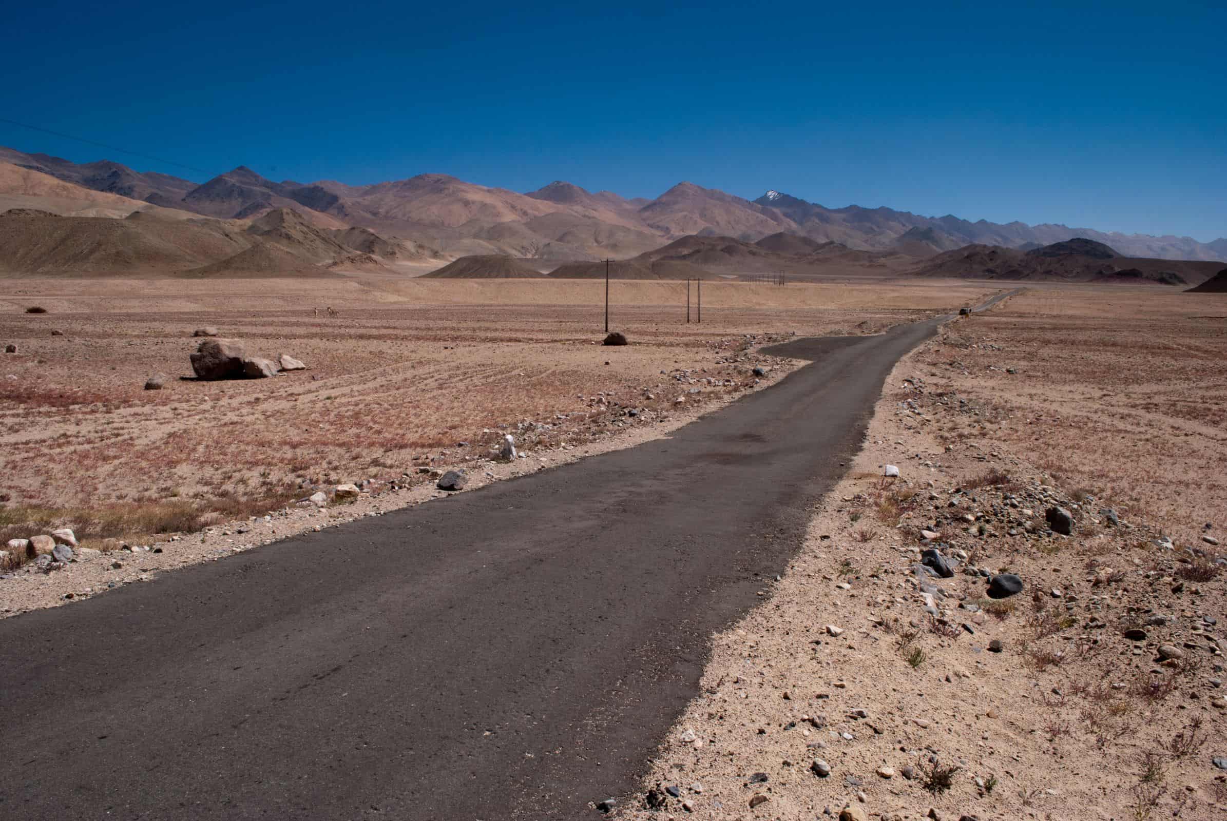 Empty narrow road through the Changthang plateau on a Ladakh self drive trip