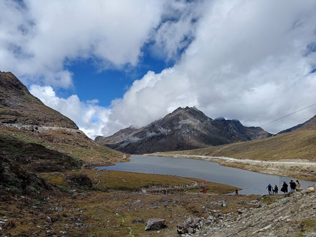 Sela Lake near Sela Pass, Arunachal Pradesh, in October with tourists walking by the shore