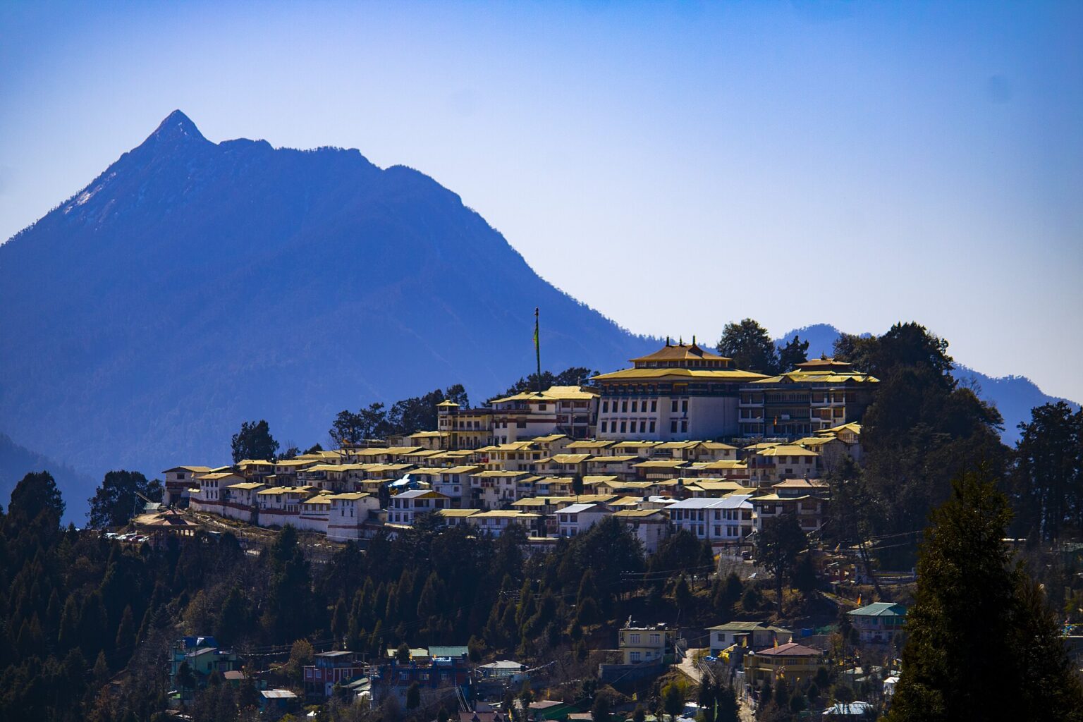 Tawang and Arunachal Pradesh Travel Guide 2026: Permits (ILP/PAP), Sela Pass, Costs and Best Route Tawang Monastery on its ridge above Tawang town, Arunachal Pradesh, with mountains behind