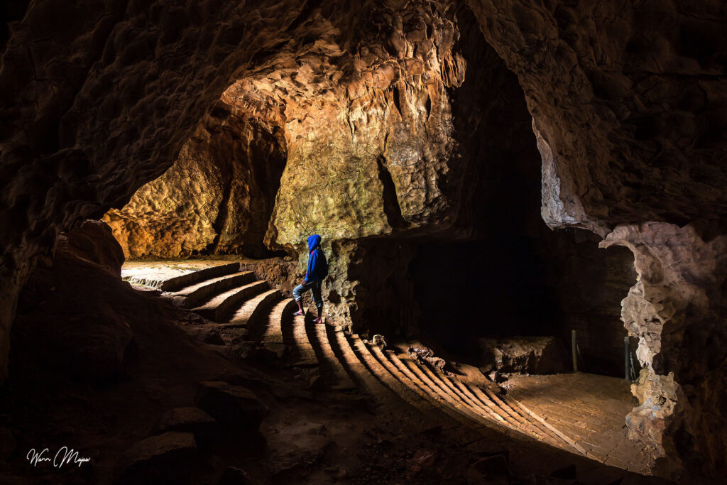 Paved walkway inside the entrance chamber of Arwah Cave near Cherrapunji