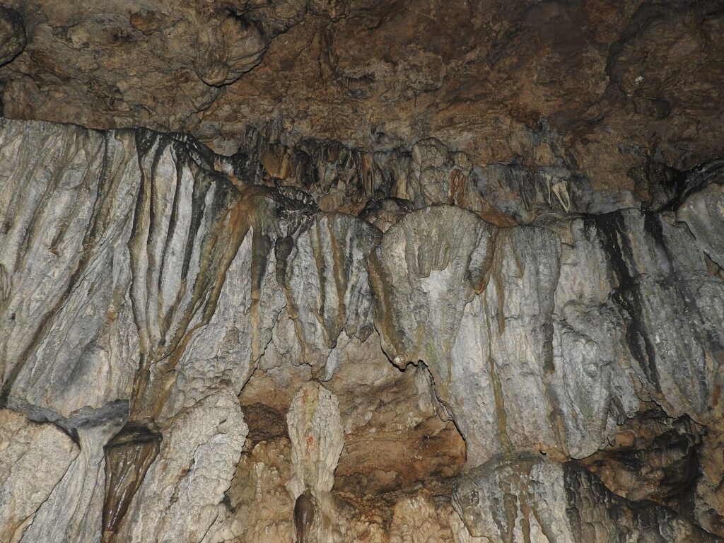 Flowstone and stalactite formations inside Mawsmai Cave Sohra