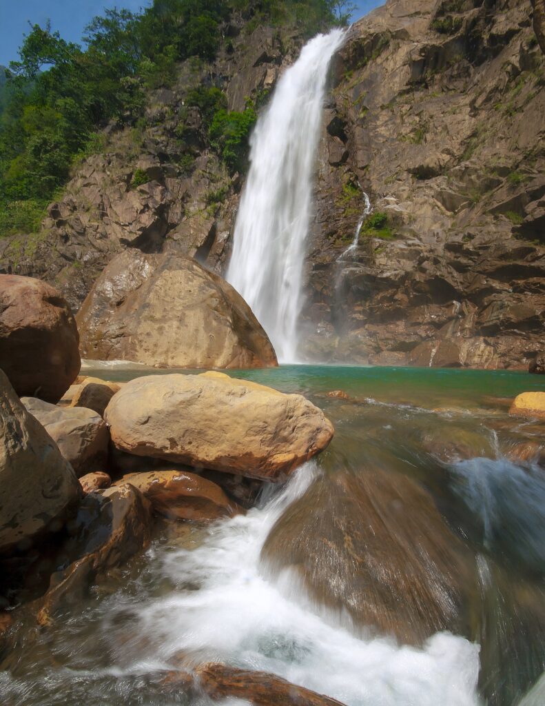 Rainbow Falls and its turquoise pool beyond Nongriat village, Meghalaya