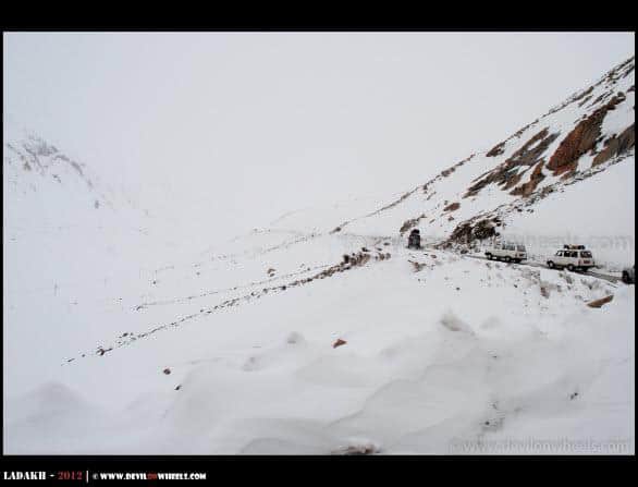 Vehicles Lining Up to Khardung La Pass in Snow