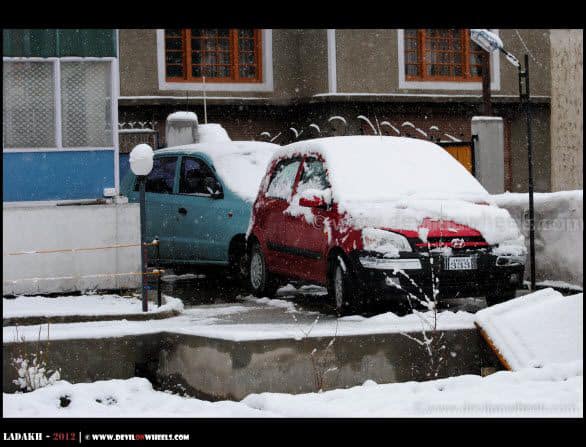 Snow Sheets Over Cars in Leh